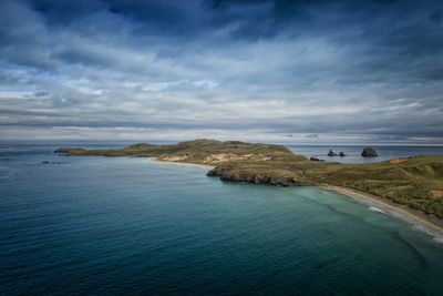 Scenic view of bay against sky