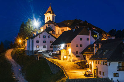 Clear and starry sky. night in the village of monte lussari. italy