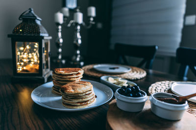 Close-up of pan cakes served on table