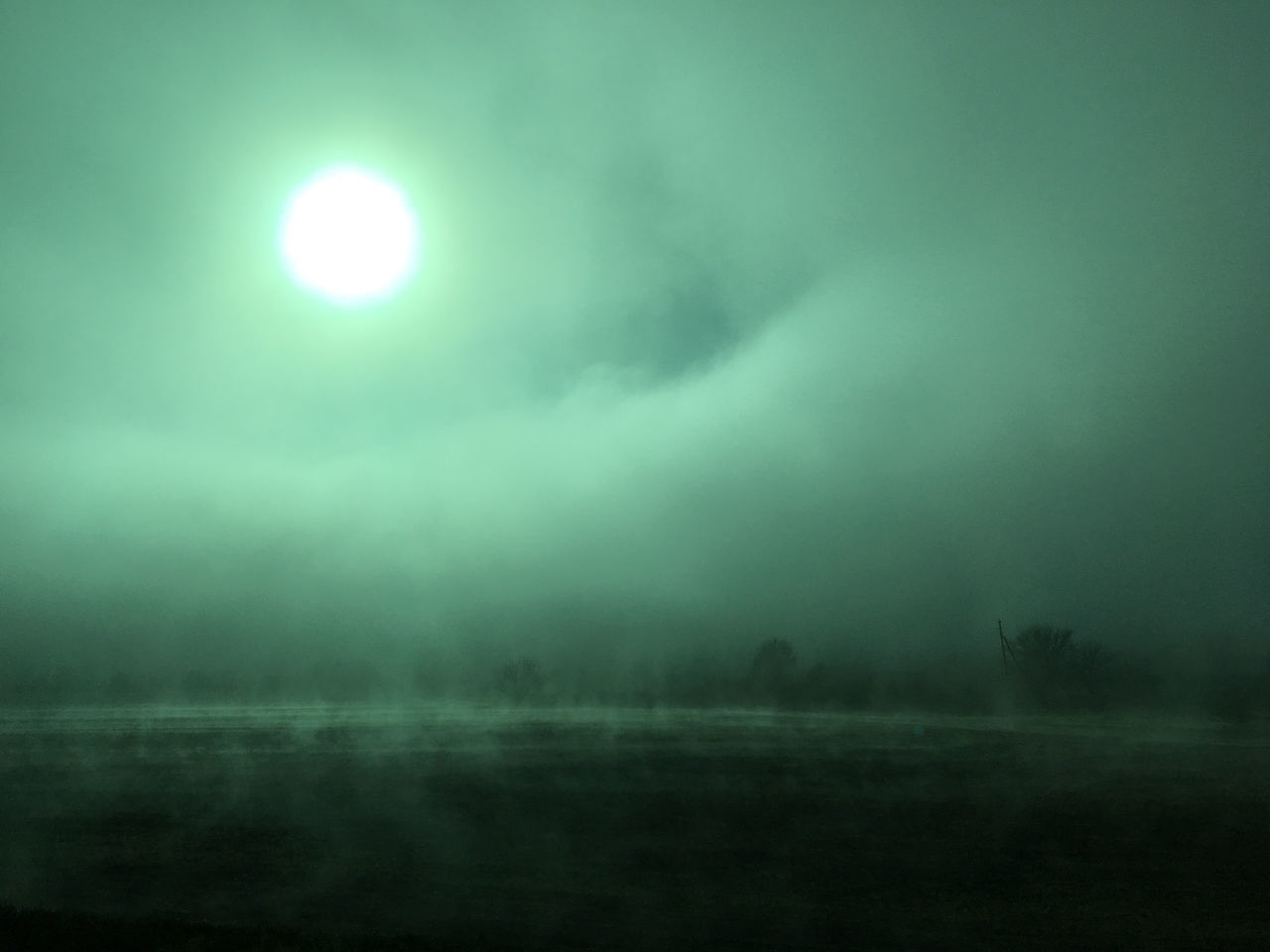 SCENIC VIEW OF FOGGY LANDSCAPE AGAINST SKY