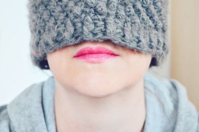 Close-up of woman wearing knit hat