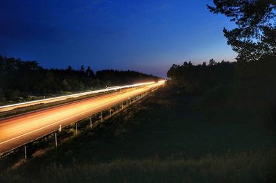 Light trails on road at night