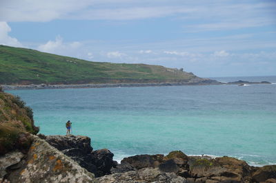 Scenic view of sea against cloudy sky