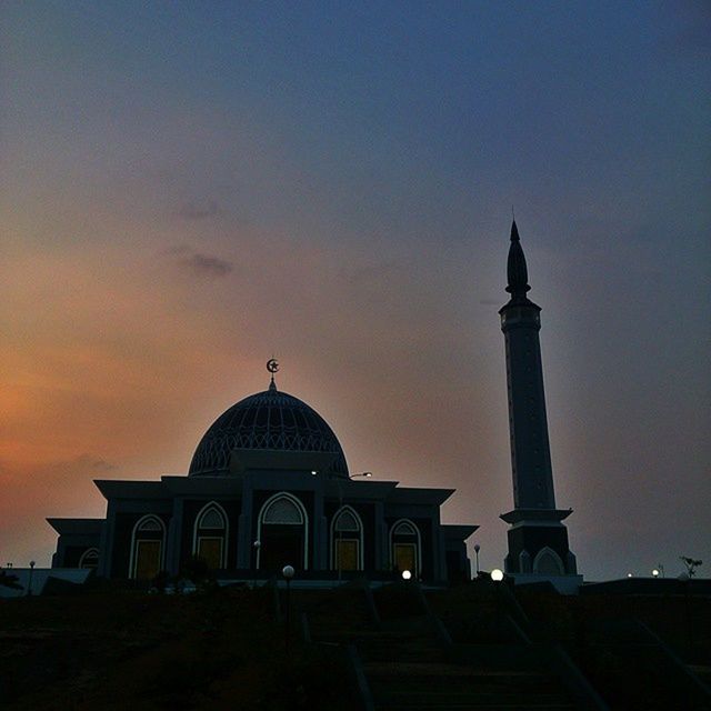 architecture, built structure, building exterior, place of worship, religion, spirituality, sunset, dome, sky, low angle view, church, silhouette, mosque, islam, outdoors, history, orange color