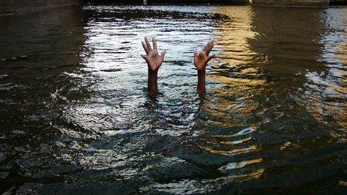 Person drowning in river