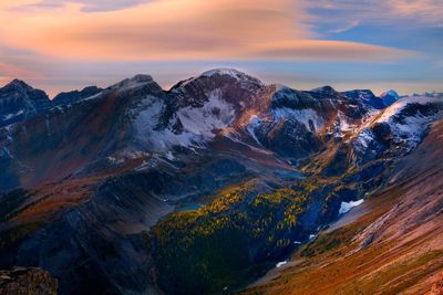 View of mountain against cloudy sky during sunset