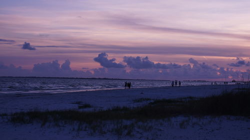 Scenic view of beach and sea against sky during sunset