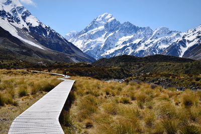 Scenic view of snowcapped mountains against sky