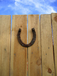 Lucky horseshoe on a wooden background