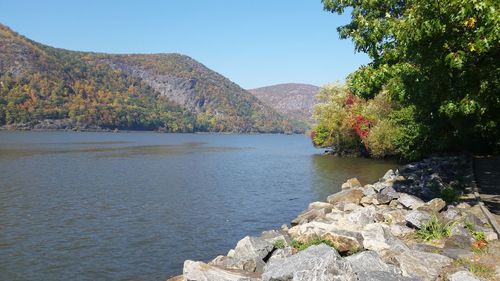 View of calm lake against mountain range