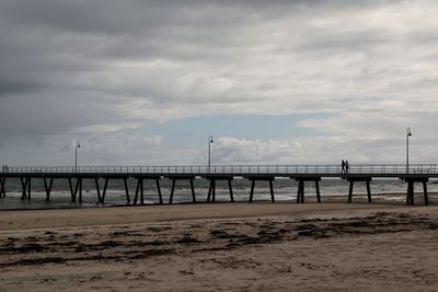 Pier over sea against sky