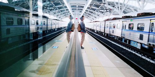 People waiting at railroad station platform