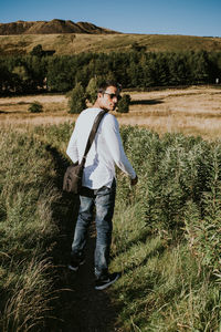 Full length of man standing on field