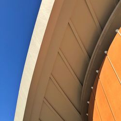 Low angle view of building against clear blue sky