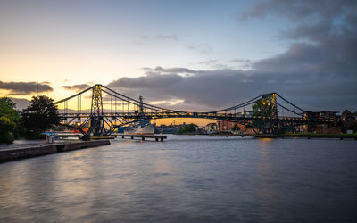 View of suspension bridge at sunset