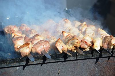 Close-up of meat on barbecue grill