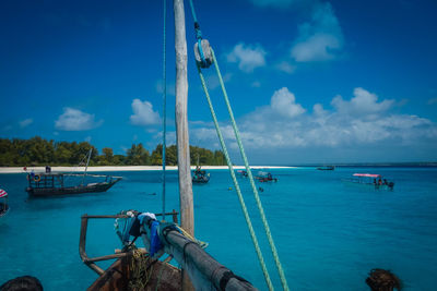 Sailboat on sea against blue sky