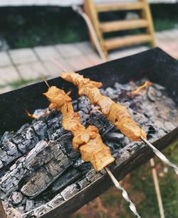 Close-up of meat on barbecue grill