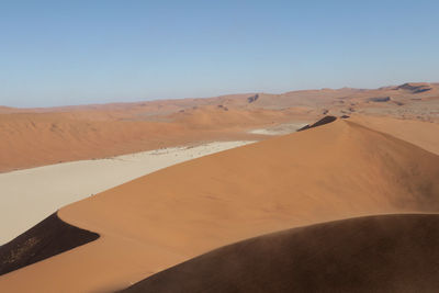 Scenic view of desert against clear sky