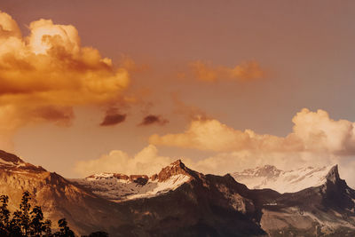 Panoramic view of mountains against sky during sunset