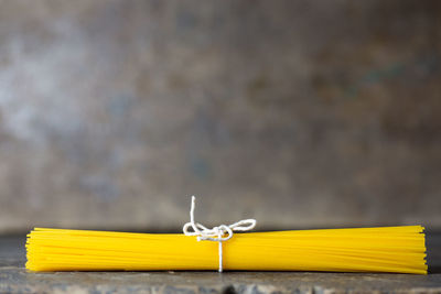 Close-up of raw spaghetti on table