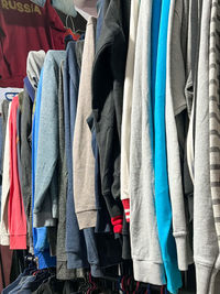 Low angle view of clothes hanging in store