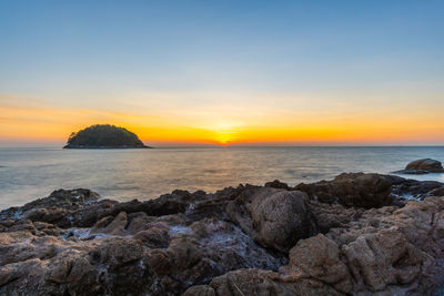 Scenic view of sea against sky during sunset