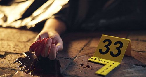 Midsection of man playing with toy blocks on table