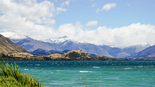 Scenic view of lake against mountain range