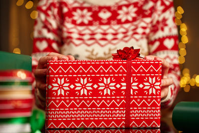Midsection of woman holding gift box
