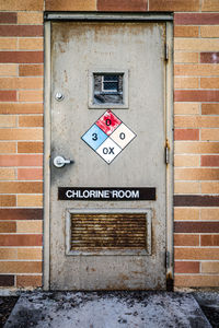 Close-up of text on brick wall