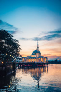 View of illuminated city at sunset