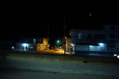 Illuminated street light at night