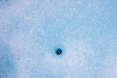 High angle view of hole on iceberg