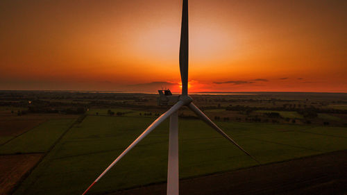 Scenic view of field against sky during sunset