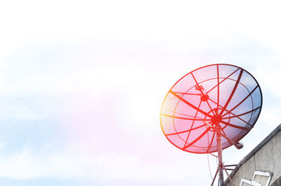 Low angle view of ferris wheel against sky