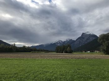 Scenic view of agricultural field against sky