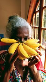 Close-up of man holding fruit