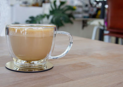 Close-up of coffee cup on table