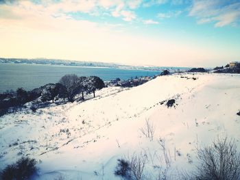 Scenic view of sea against sky during winter