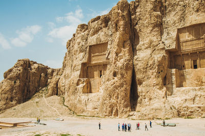 Group of people in front of built structure