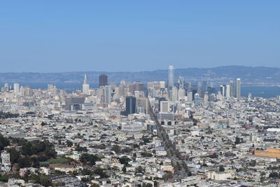 Aerial view of city buildings against sky