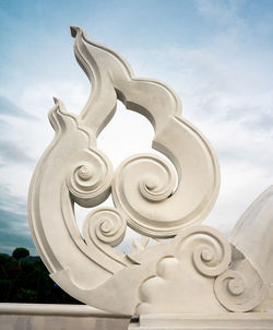 Low angle view of sculpture against sky