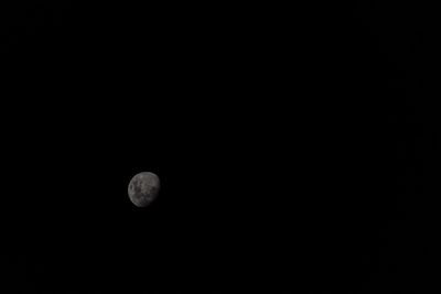 Low angle view of moon against sky at night