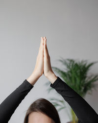 Low section of woman against white background