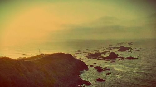 Scenic view of sea at sunset