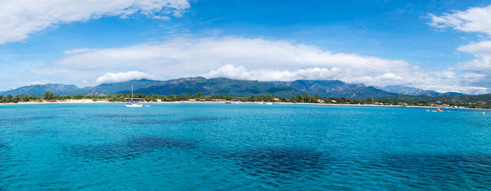 Scenic view of sea against cloudy sky