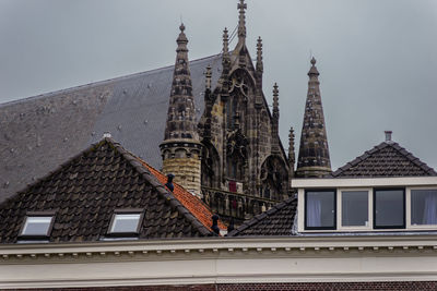 House rooftops and hooglandese church towers in the background 