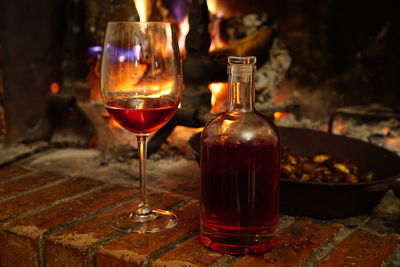 Close-up of wine glasses on table