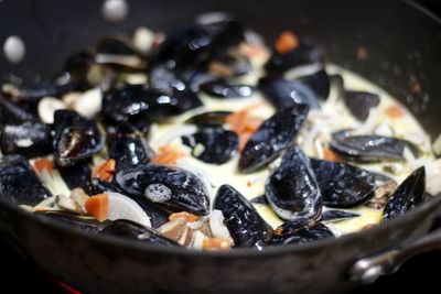 Close-up of mussel broth in container
